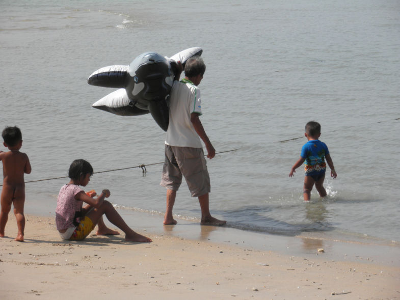 Thai family playing in sea