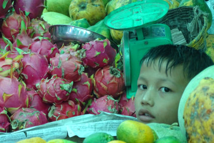 Young grocery seller on the market