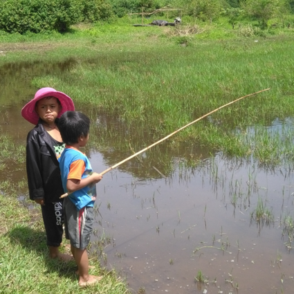 Local kids fishing in lake Batur Bali