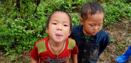 Happy children by the Ha Giang Route